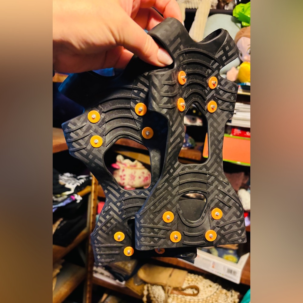 New Women's Black and Orange Traction Cleats size larger